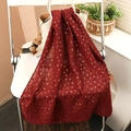 Deep red cotton linen hijab scarf with golden leaf pattern draped on a white bag - Wine Red (6)