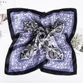 Blue and black paisley satin square scarf in classic spiral fold presentation - Dark Blue