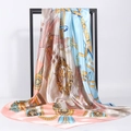 Satin silk scarf with vintage equestrian belt print hanging on a metal display frame - 90*90cm / Pink Blue Equestrian Medallion