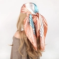 90cm paisley silk-satin scarf in light orange and blue, tied as an elegant headscarf - Spliced Pink Blue
