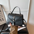 Minimalist black woven texture handbag with gold horseshoe buckle and top handle - Black