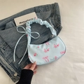 Light blue underarm bag with pink rose and bow prints featuring ruched handle - Blue
