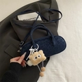 Dark blue suede baguette bag with subtle leopard embossing and plush monster charm - Blue with Pendant