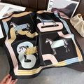 Black silk-feel square scarf featuring horse prints and colorful striped border decor - Carriage Black
