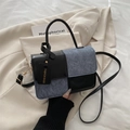 Contrast panel small square bag in black and gray textured fabric with a fashion tag - Black