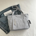 Light grey-blue corduroy tote bag with large zipper pocket and woven puller detail - Dark Gray