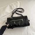 Minimalist black cylinder shoulder bag in glossy PU leather with silver zipper detail - Black