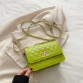 Neon green quilted crossbody bag with gold metal twist lock and chain strap design - Green