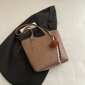 Brown leather tote bag with plush bear charm and adjustable strap on a white background - No Pendant / Tan