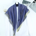 Detail of navy blue shawl with gold thread and wide golden borders on white shirt - Blue