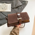 Retro brown contrast underarm bag with metal H-buckle shown in a lifestyle scene - Brown