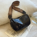 Retro black Boston bag with ethnic geometric wide strap and tassel detail - Black