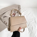 Chic apricot crocodile texture mini crossbody bag featuring a unique knotted handle design - Khaki
