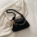 Fashionable black matte crossbody bag with woven strap and ethnic tassel charm - Black With Pendant