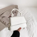 White faux crocodile skin handbag with stylish knot handle and golden hardware - White