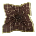 Close-up of brown square scarf featuring golden metallic grid pattern and silky texture - Coffee