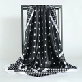 Classic black and white polka dot satin square scarf draped on a minimalist stand - 90x90cm / Black
