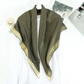 Elegant bronze gold shimmer scarf with satin trim displayed on a white shirt - Black