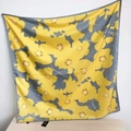 Silk twill square scarf with yellow floral prints and grey border hanging on wall - Yellow Floral Style / Yellow Floral