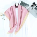 Pink lightweight scarf with gold metallic border draped on a white shirt - Nude Pink