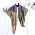 Retro geometric print silk square scarf in purple and green on golden hanger - Purple