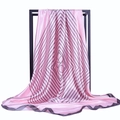 Pink satin square scarf with black geometric stripes displayed on a minimalist frame - Pink
