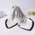 French style striped silk satin scarf draped over a white handbag for a minimalist look - White