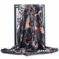 Elegant black silk scarf with orange paisley patterns draped on a black frame - Best-selling (Black Print)