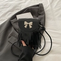 Small black shoulder bag with golden bow hardware and elegant fringe tassels - Black