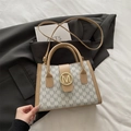 Khaki and beige monogram shoulder bag with gold M buckle and adjustable strap - White