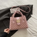 Pink faux leather shoulder bag featuring brown M-monogram print and golden metal buckle - Pink