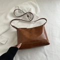 Minimalist brown leather tote bag with adjustable shoulder strap and zip closure - Brown