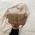 Minimalist light brown leather crossbody bag with a sleek strap and magnetic flap closure - Khaki