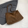 Chic brown leopard print shoulder tote bag in soft suede fabric on grey blazer background - Brown