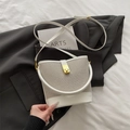 Chic white bucket bag featuring mesh hollow panels and gold clasp on black blazer backdrop - White
