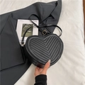 Fashionable black heart-shaped crossbody bag with V-shaped quilting and gold hardware - Black