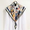 Graffiti floral silk scarf with silver buckle ring shown over white shirt - Grey Nepal