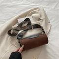 Brown frosted cylinder bag featuring black leather trim and ethnic patterned wide strap - Brown
