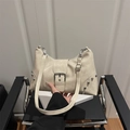 Retro cream tote bag with silver studs and metal buckle detail on polished faux leather - Off White