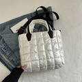 Quilted white puffer tote bag with black strap and padded nylon texture for women - White