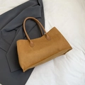 Vintage brown faux suede tote bag displayed on a dark grey blazer with a minimalist design - Brown