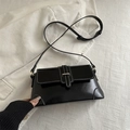Elegant black shoulder bag with contrast white stitching and decorative buckle design - Black