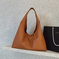 Minimalist caramel brown PU leather tote bag with a spacious underarm carry design - Brown