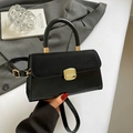 Schwarze Wildleder-Patchwork-Handtasche mit goldenen Details und Schultergurt - Schwarz