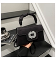Detail of elegant black velvet handbag featuring crystal square buckle and pleated handle - Black