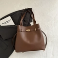 Classic dark brown leather tote bag with gold twist lock and spacious bucket design - Brown