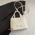 Elegant white trapezoid handbag with FASHION metal plate and detachable shoulder strap - White