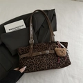 Leopard print faux suede shoulder bag with adjustable brown straps and plush bear charm - Coffee With Pendant