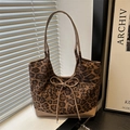 Chic leopard print tote bag with brown leather handles and a delicate bow detail - Khaki