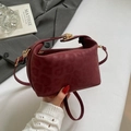 Deep red leopard embossed crossbody bag with gold buckle and adjustable strap - Red